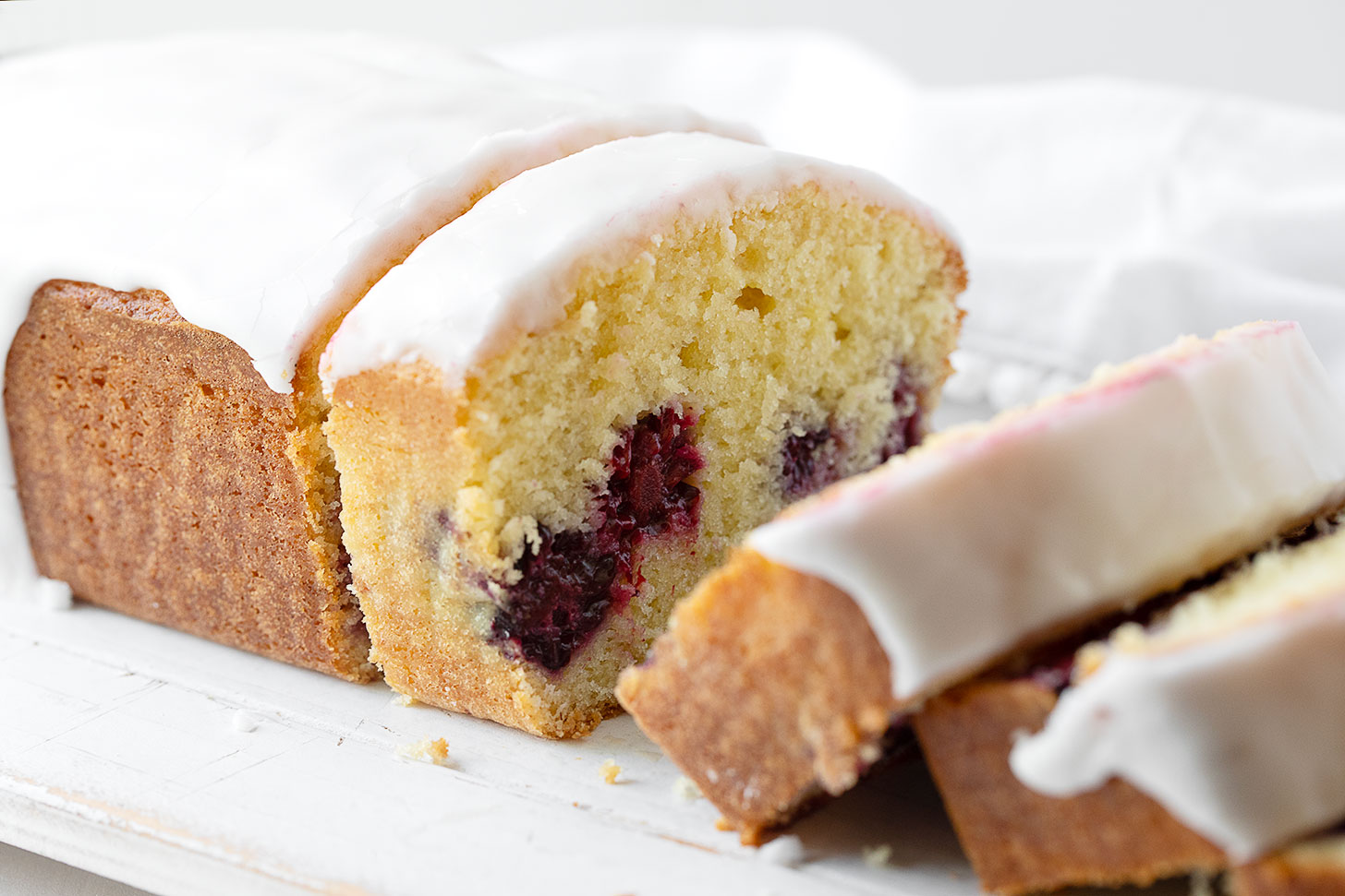 Lemon blackberry bread slices the slice plate.