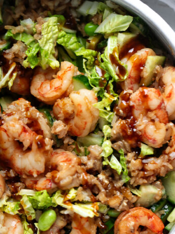 Teriyaki shrimp with crispy rice in a serving bowl.