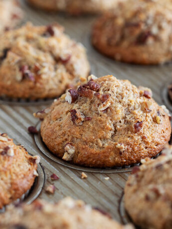 Whole wheat banana chocolate chip muffins in muffin tin.