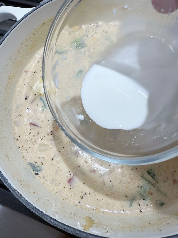 Thickening the finished soup with a cornstarch slurry.