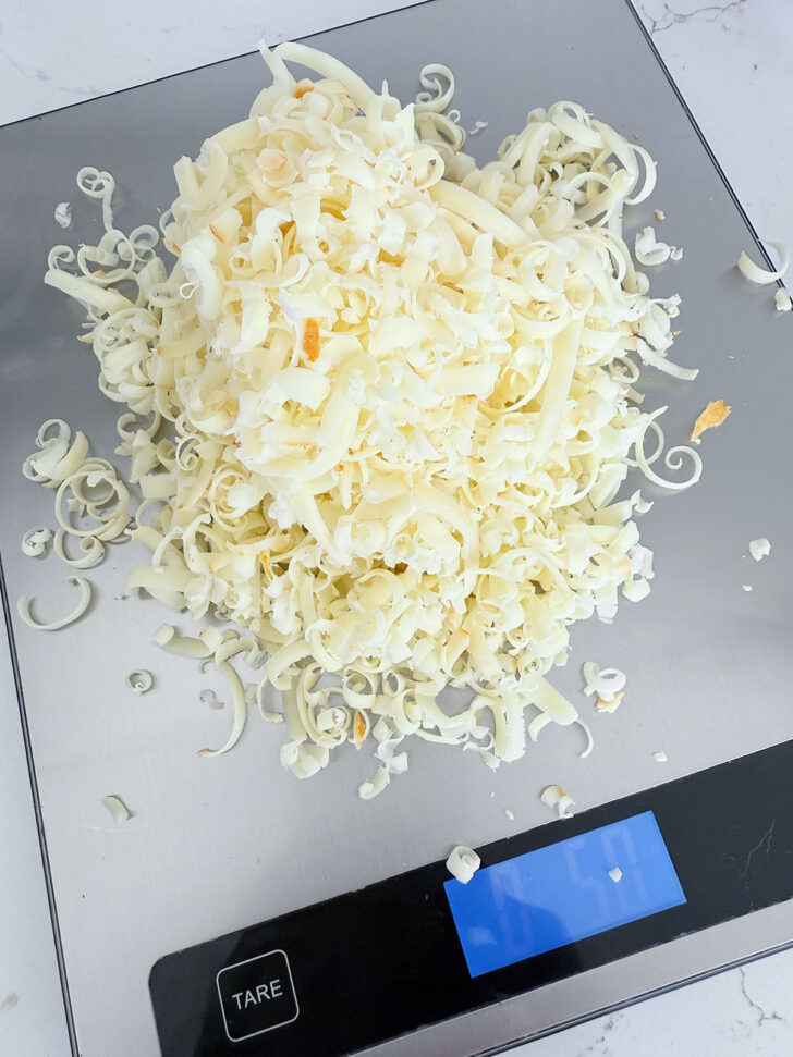Weighing out the shredded cheddar cheese.