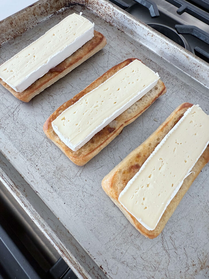 Brie slices placed on top of the fig jam.