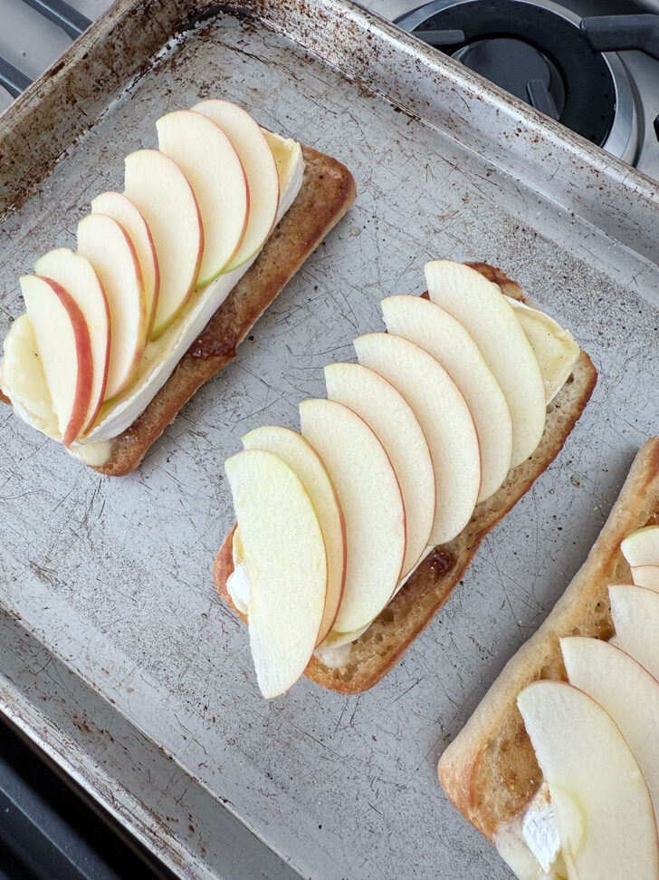 Apple slices on top of the melty Brie cheese.