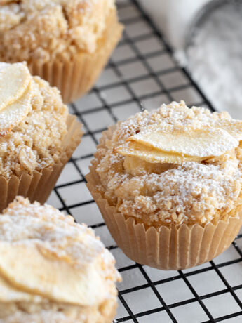 Apple crisp muffins on cooling rack.