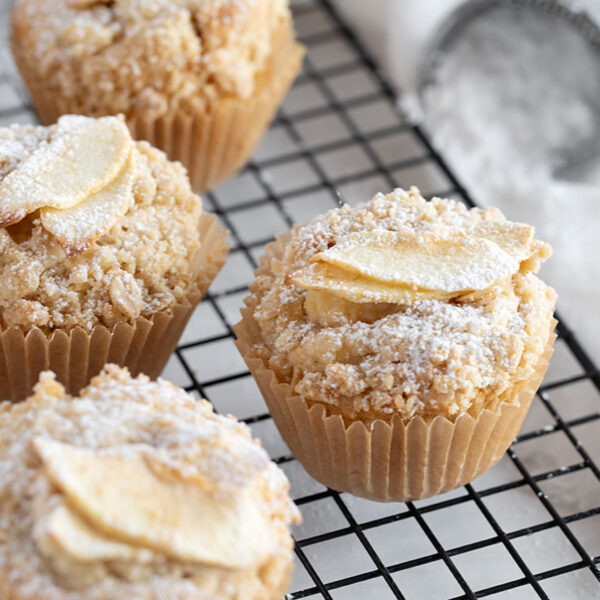 Apple crisp muffins on cooling rack.