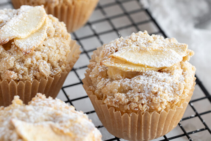 Apple crisp muffins on cooling rack.