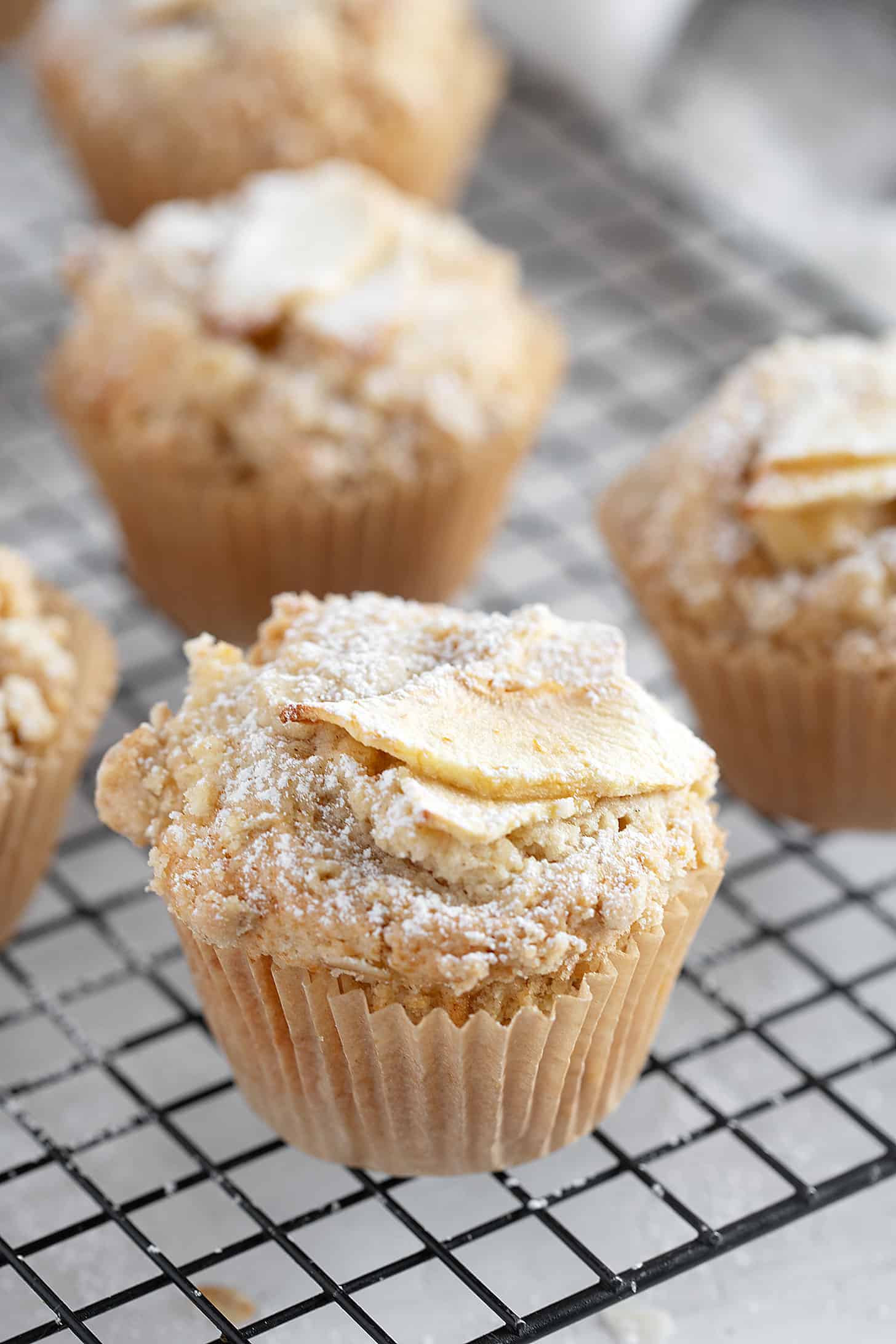 Apple crisp muffins on cooling rack.