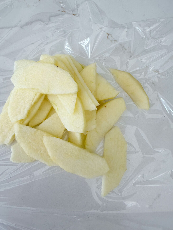 Apple cut into thin slices for topping the muffins.