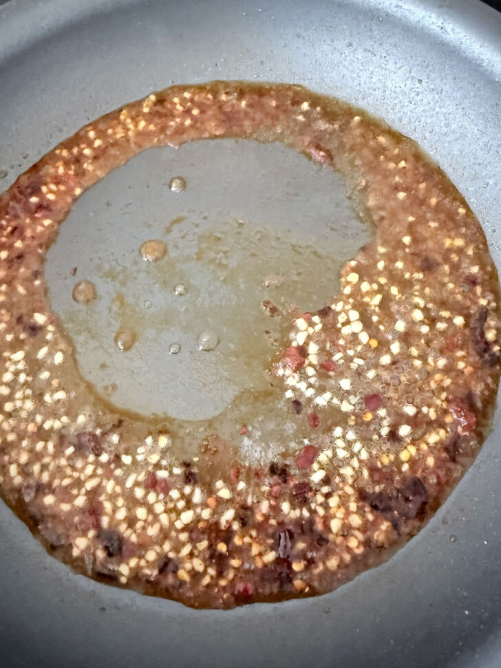 Vodka added to the skillet and cooking off.