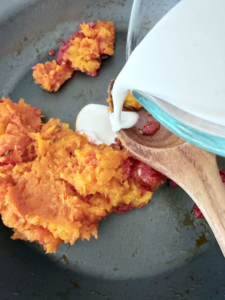 Adding the cream to the skillet.