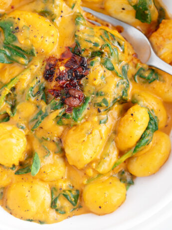 Gnocchi with butternut squash sauce in bowl.