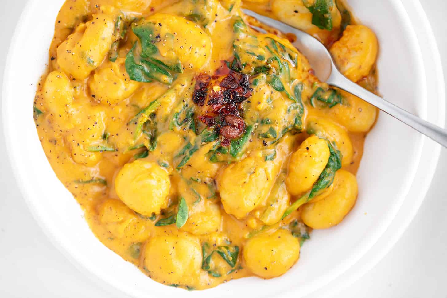 Bowl with butternut squash sauce gnocchi.