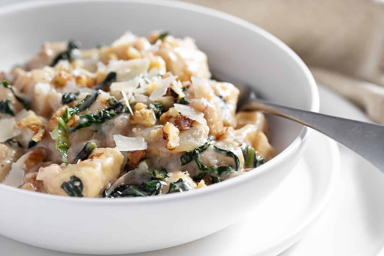 Pear and walnut gnocchi in a serving bowl.