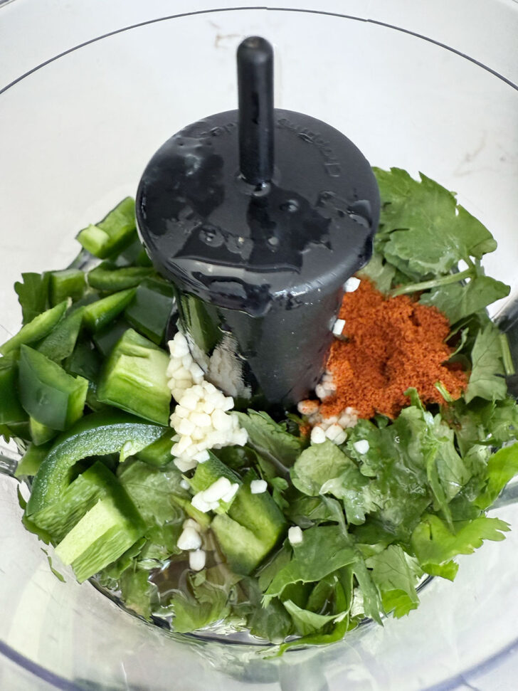 Cilantro lime dressing ingredients in a small food processor.