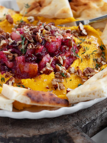 Butternut squash whipped feta on serving plate.