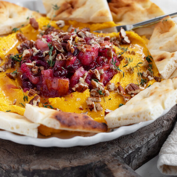 Butternut squash whipped feta on serving plate.