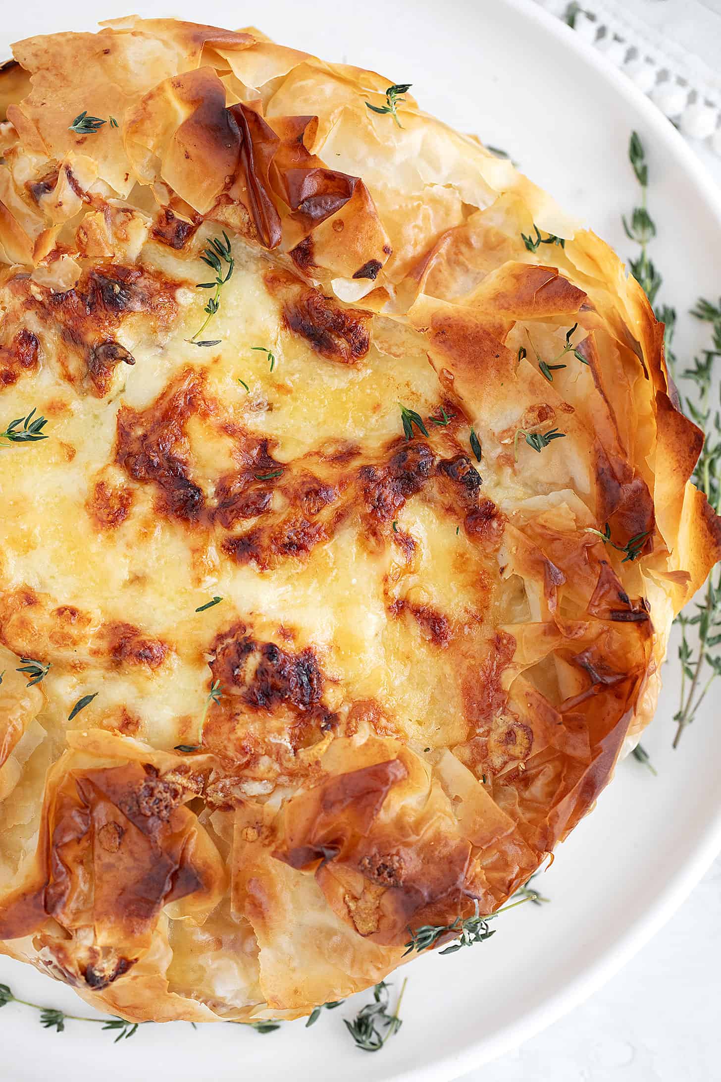 Cauliflower and cheese phyllo pie on a serving plate.