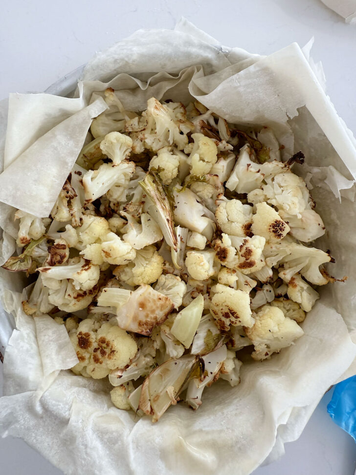Roasted cauliflower added to the pan.