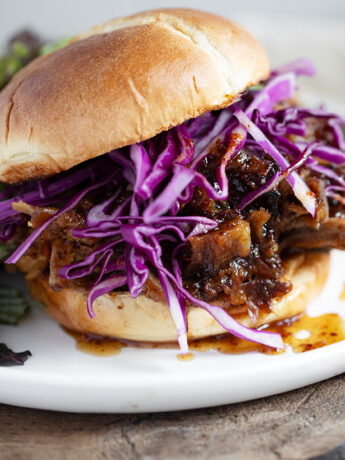 Maple mustard pulled pork on a bun with shredded cabbage.