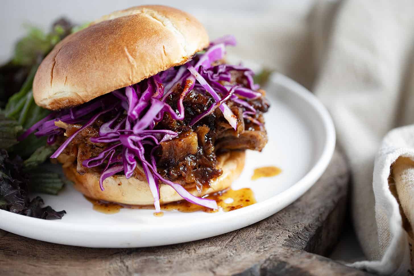 Mustard maple pulled pork on a bun with shredded cabbage.
