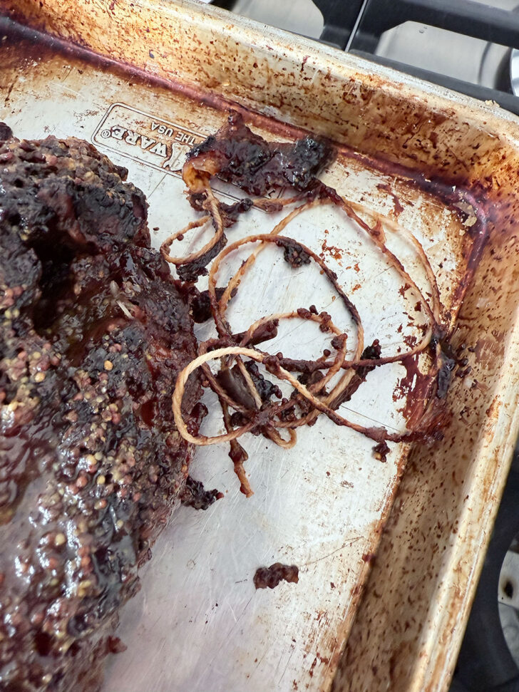 Remove the butcher's string from the pork roast.