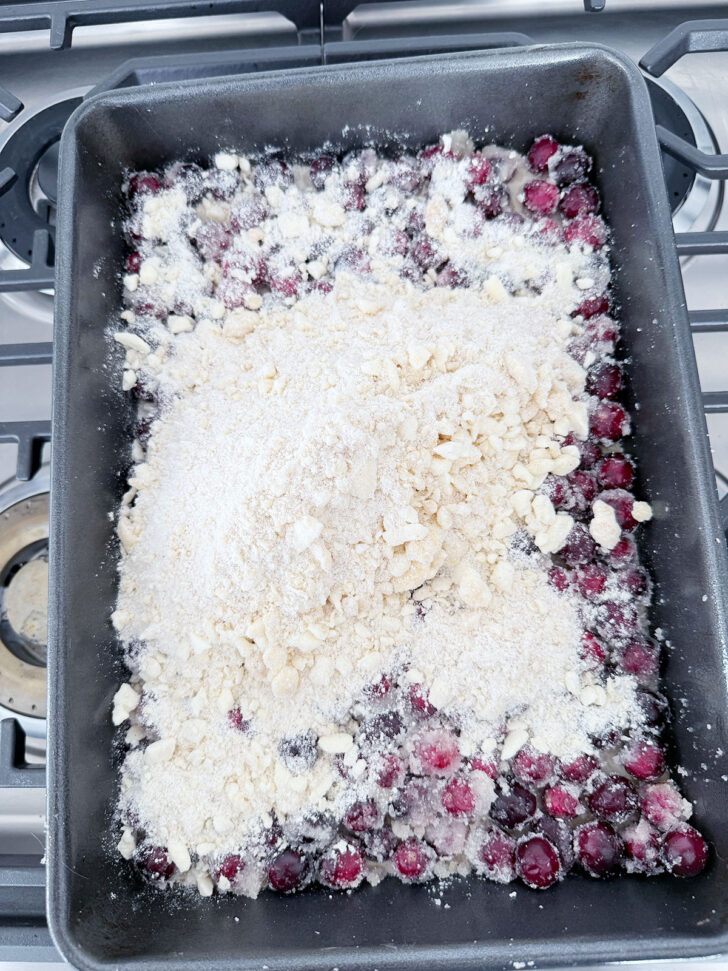 Remaining crumb poured on top of the cranberries in the baking pan.