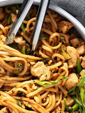 Chicken cashew noodles in a skillet.