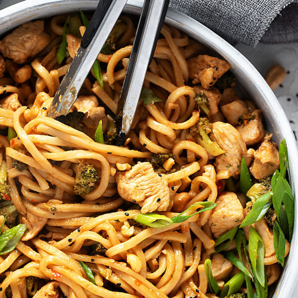Chicken cashew noodles in a skillet.