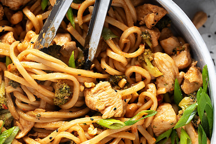 Chicken cashew noodles in a skillet.