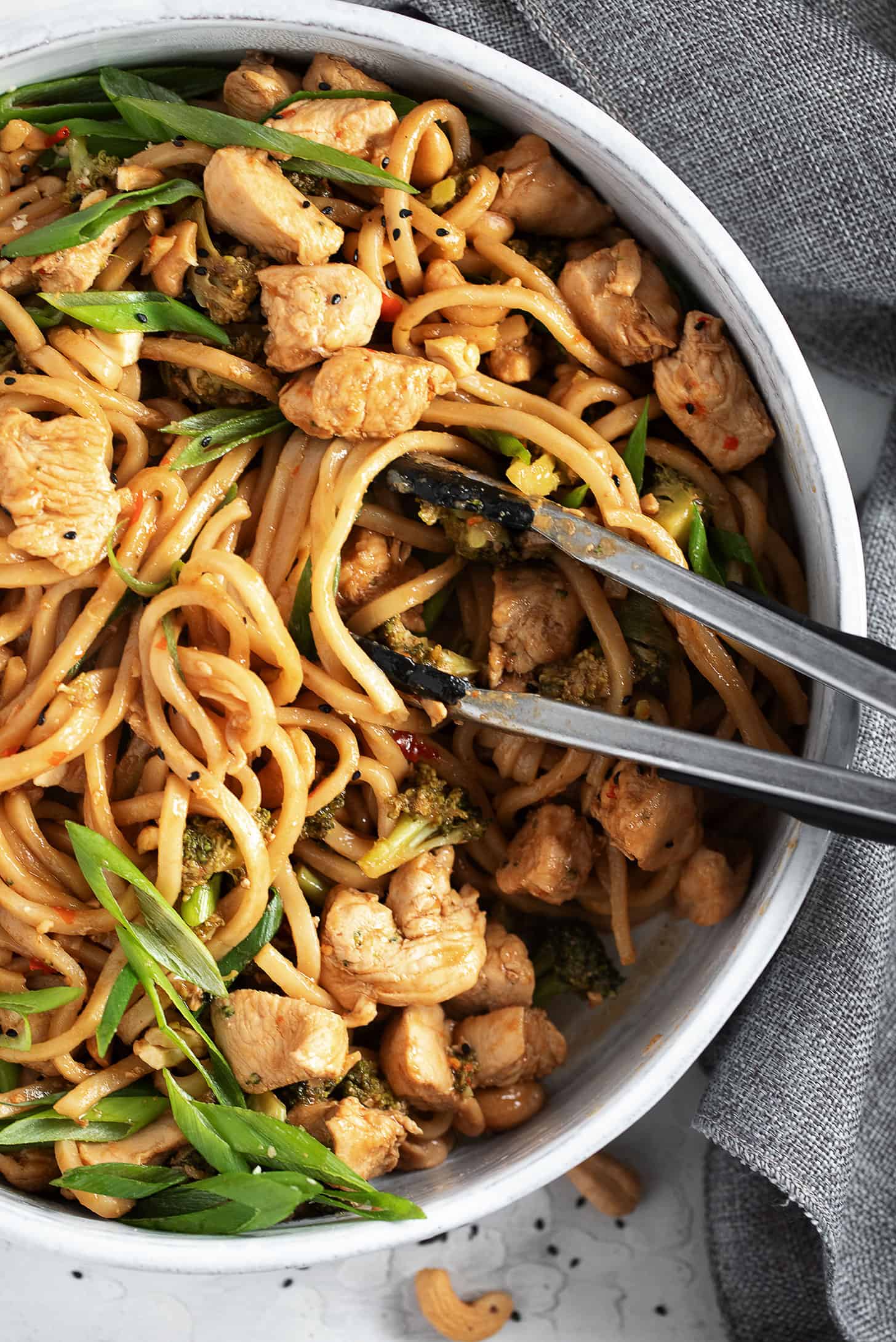 Chicken cashew noodles in a skillet.