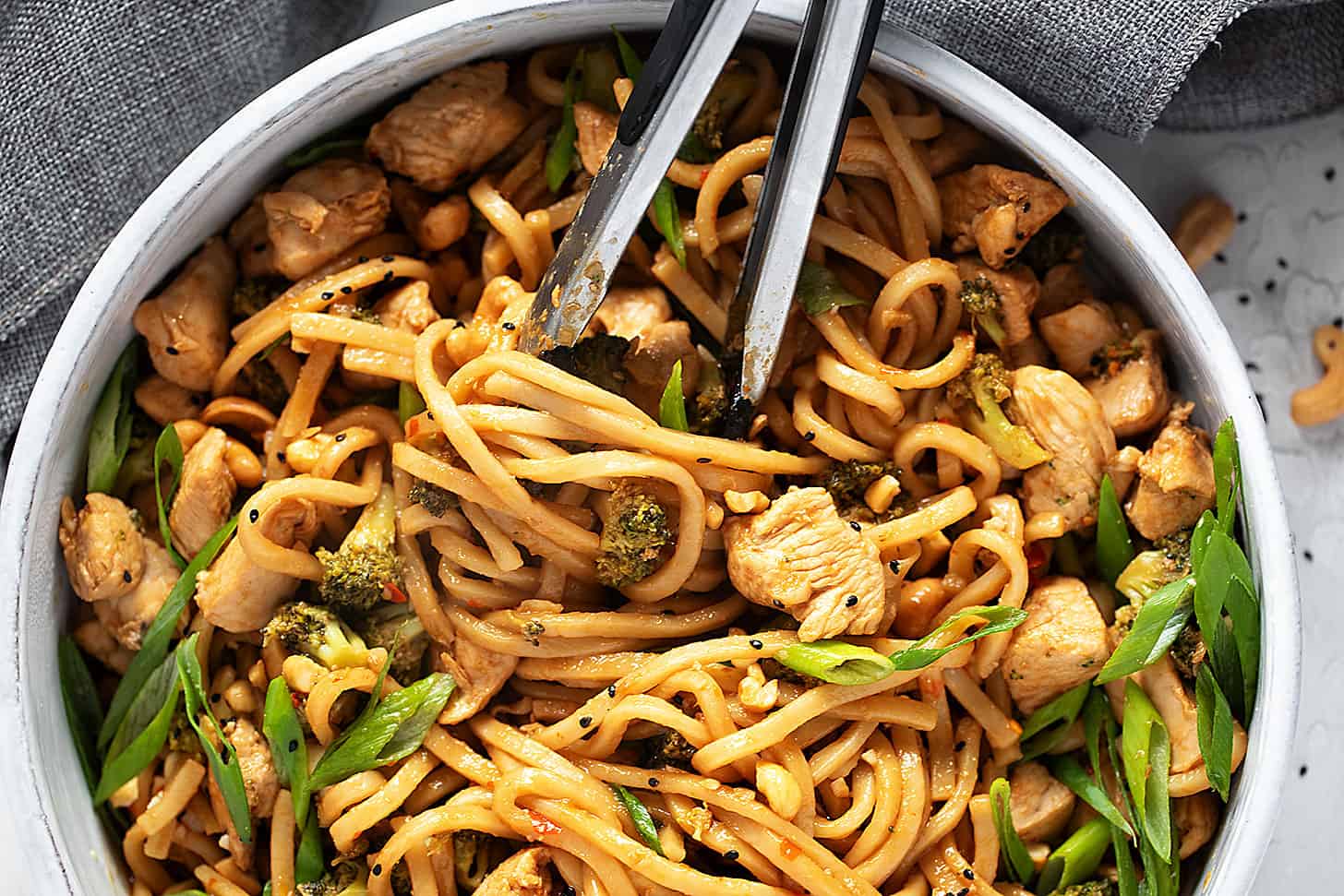 Chicken cashew noodles in a skillet.