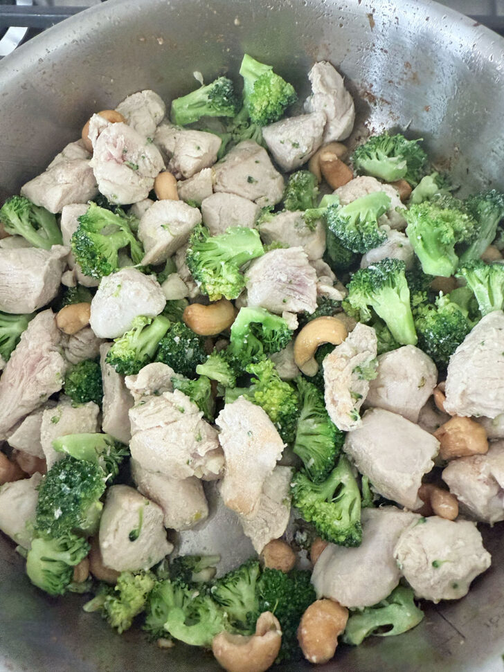 After cooking the chicken, broccoli and cashews together.