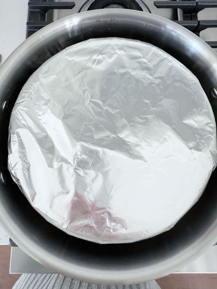 Pudding added to the pot for steaming.