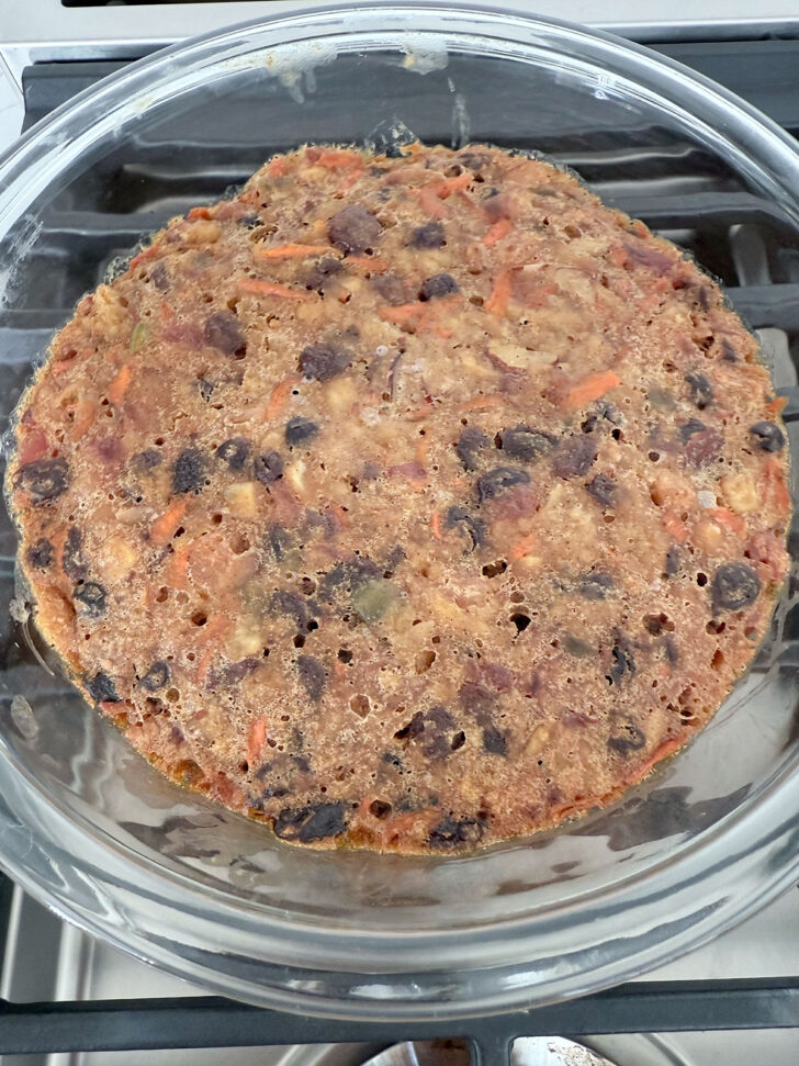 Cooked Christmas pudding in a bowl after steaming.