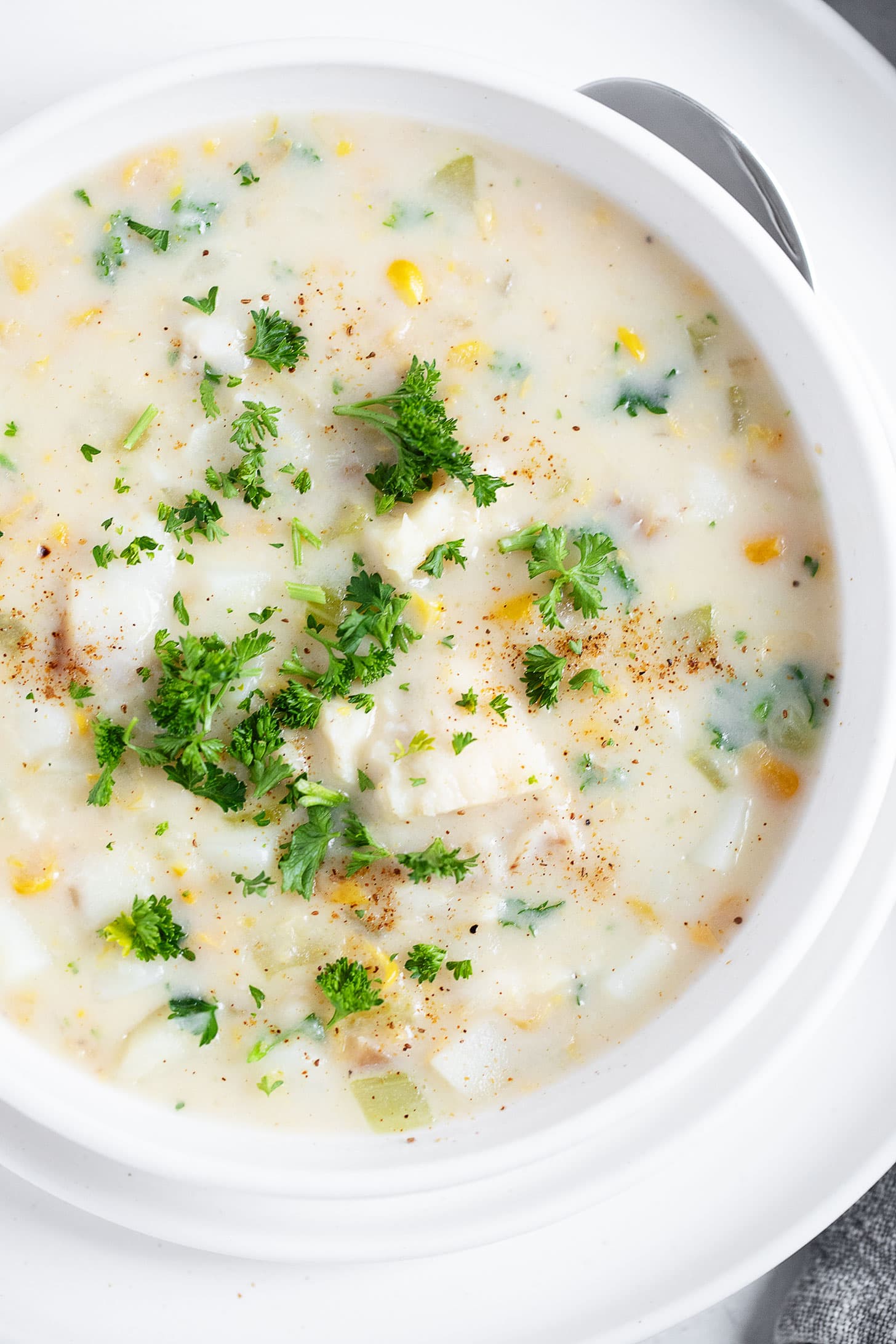 Cod chowder in a serving bowl.