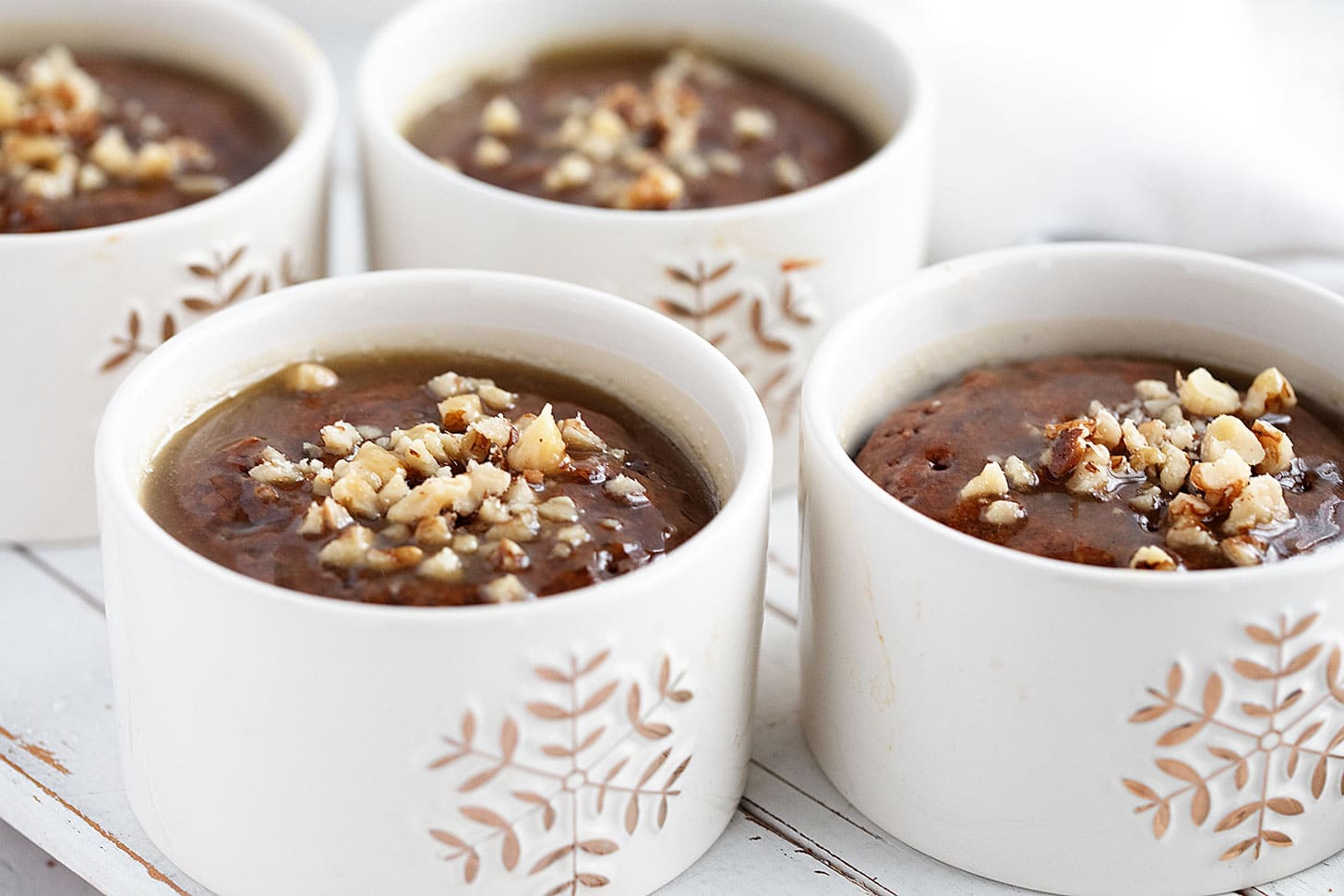 Gingerbread sticky toffee pudding in ramekins.