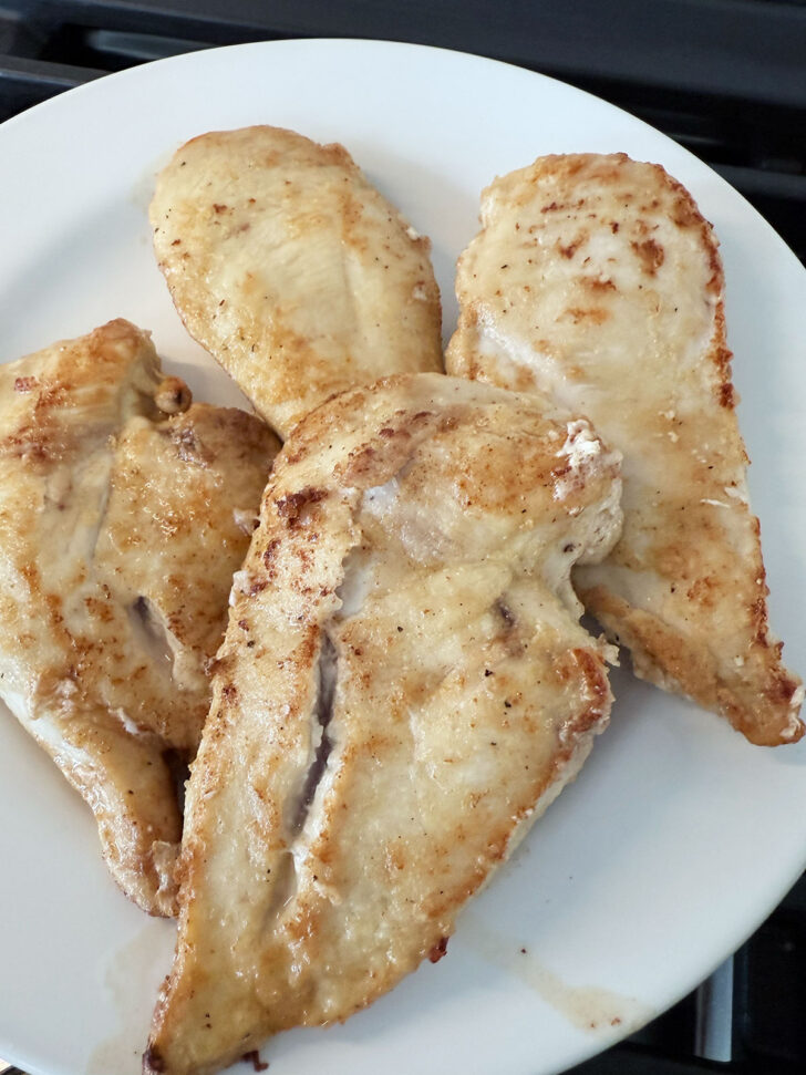 Browned cutlets removed to a plate.