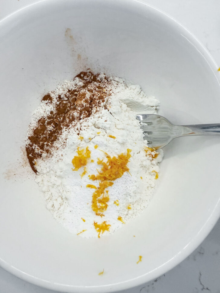 Dry ingredients added to a bowl.