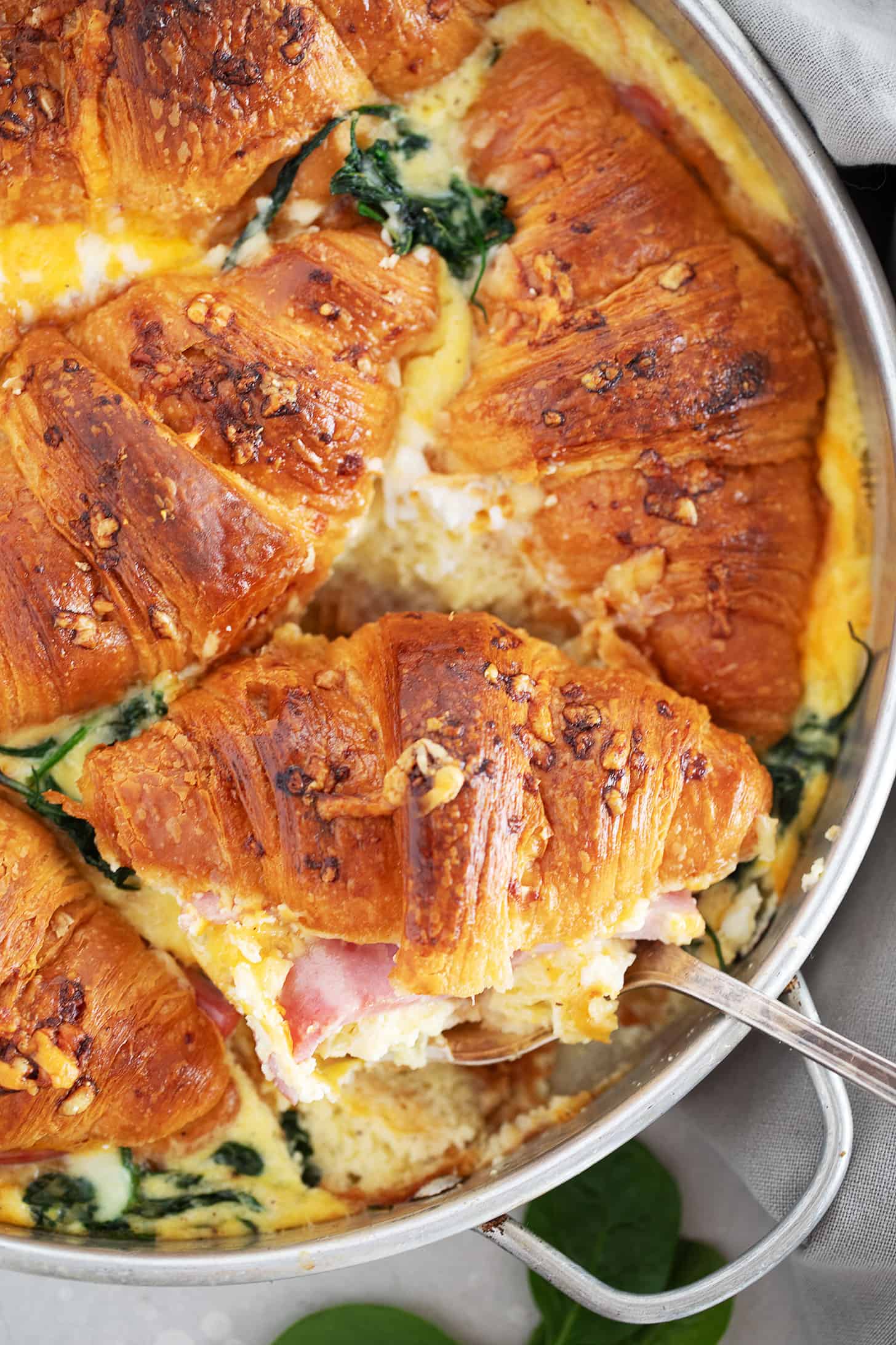 Ham and cheese croissant bake in baking pan.