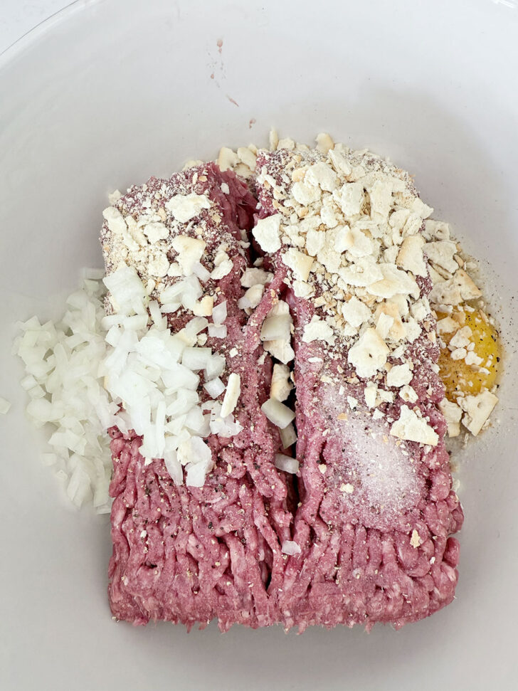 Meatloaf mixture in a mixing bowl.