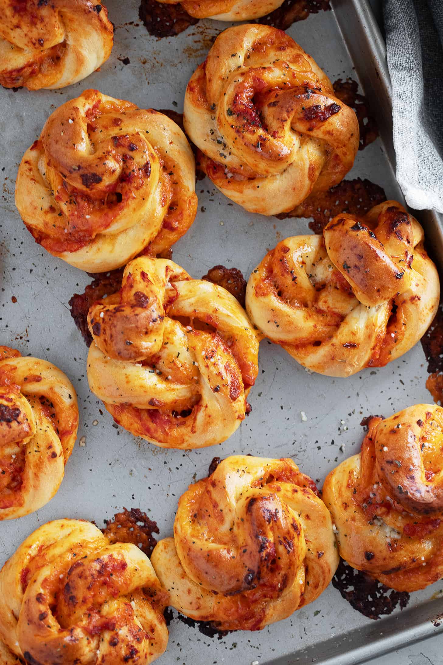 Pizza twists on the baking sheet after baking.