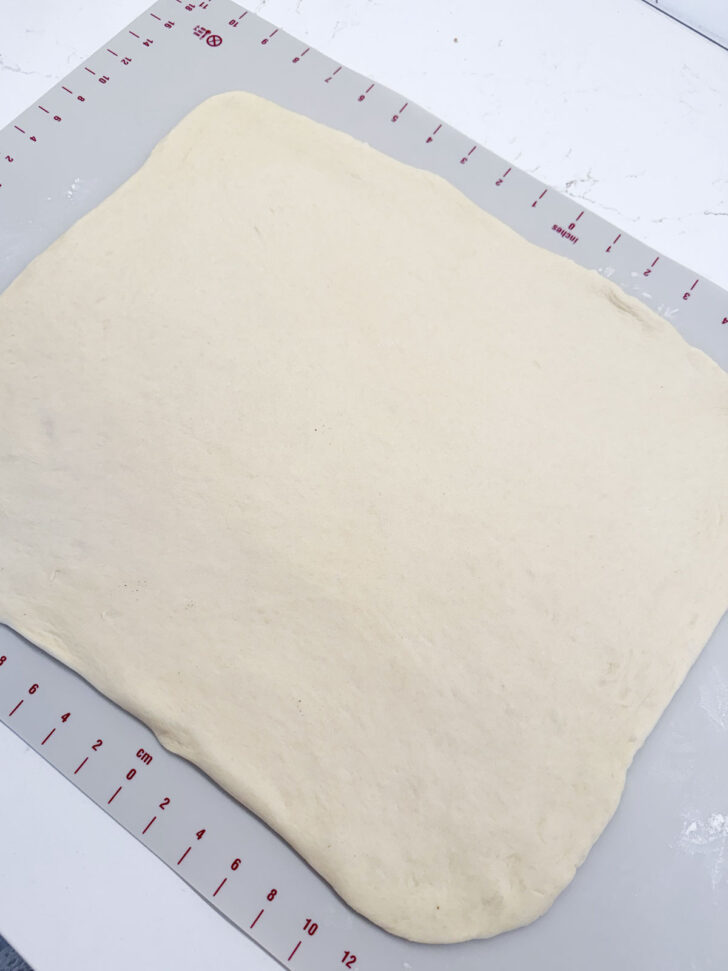 Dough rolled out into a rectangle.