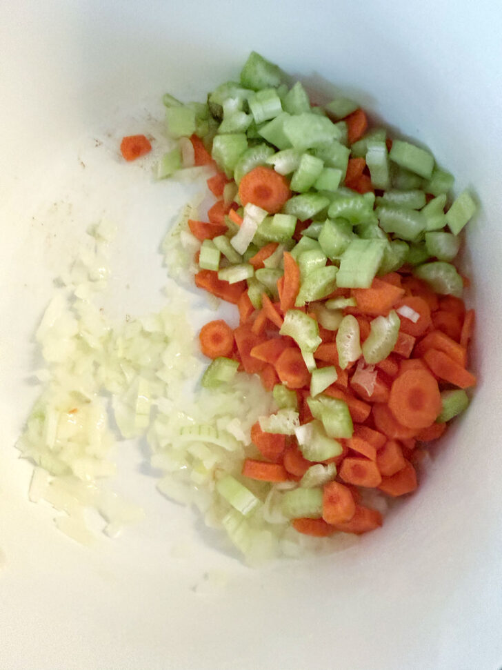 Onion, carrot and celery added to the soup pot.
