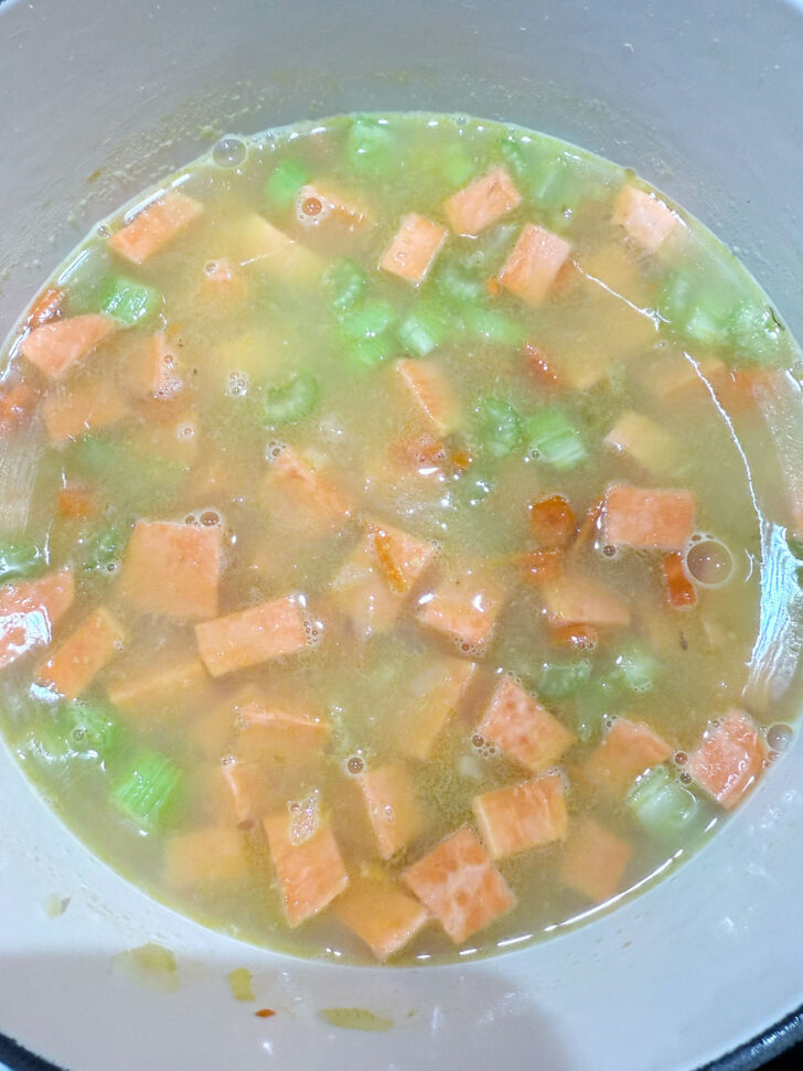 Sweet potato added to the soup pot.