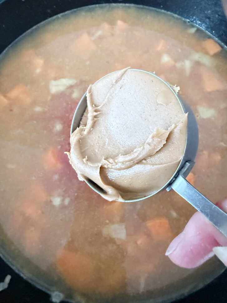 Adding the peanut butter to the skillet.