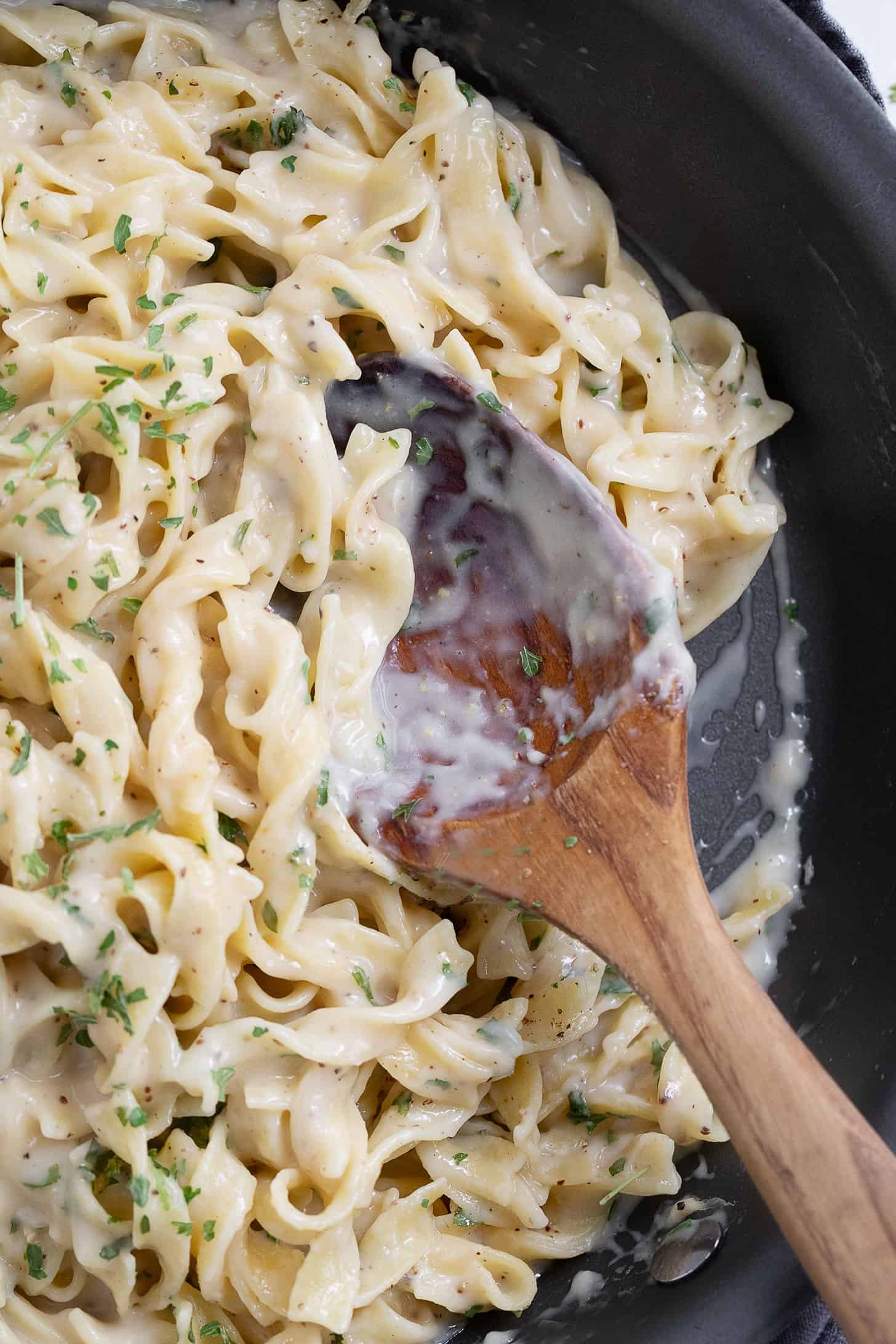 Cafeteria noodles without soup in a skillet.