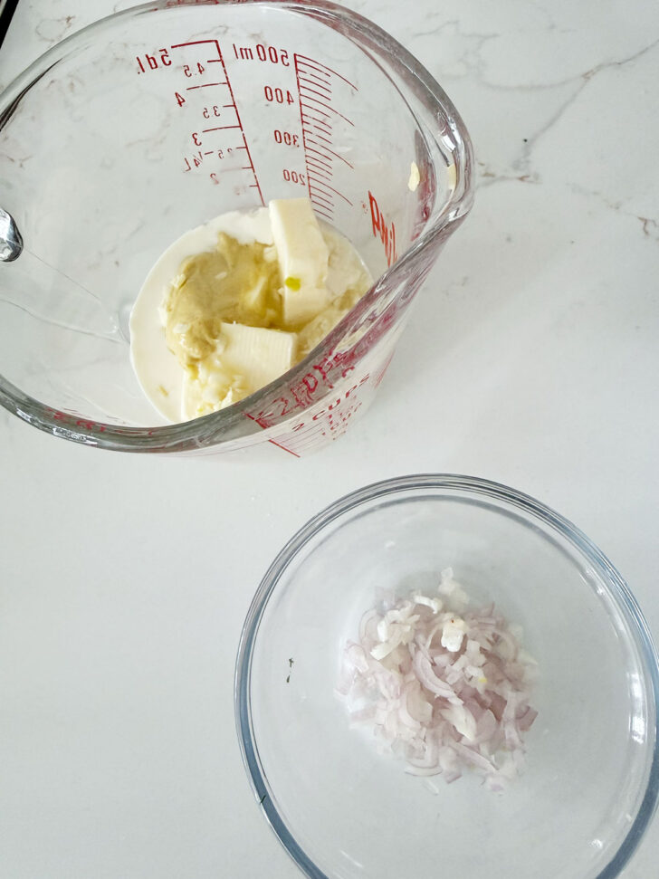 Shallots and sauce ingredients in bowls.