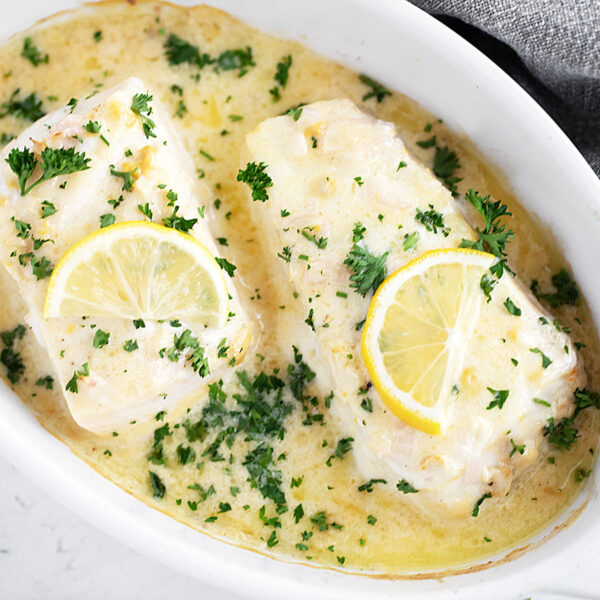 Creamy lemon baked halibut in the baking dish.