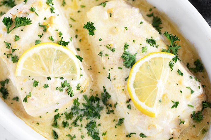 Creamy lemon baked halibut in the baking dish.
