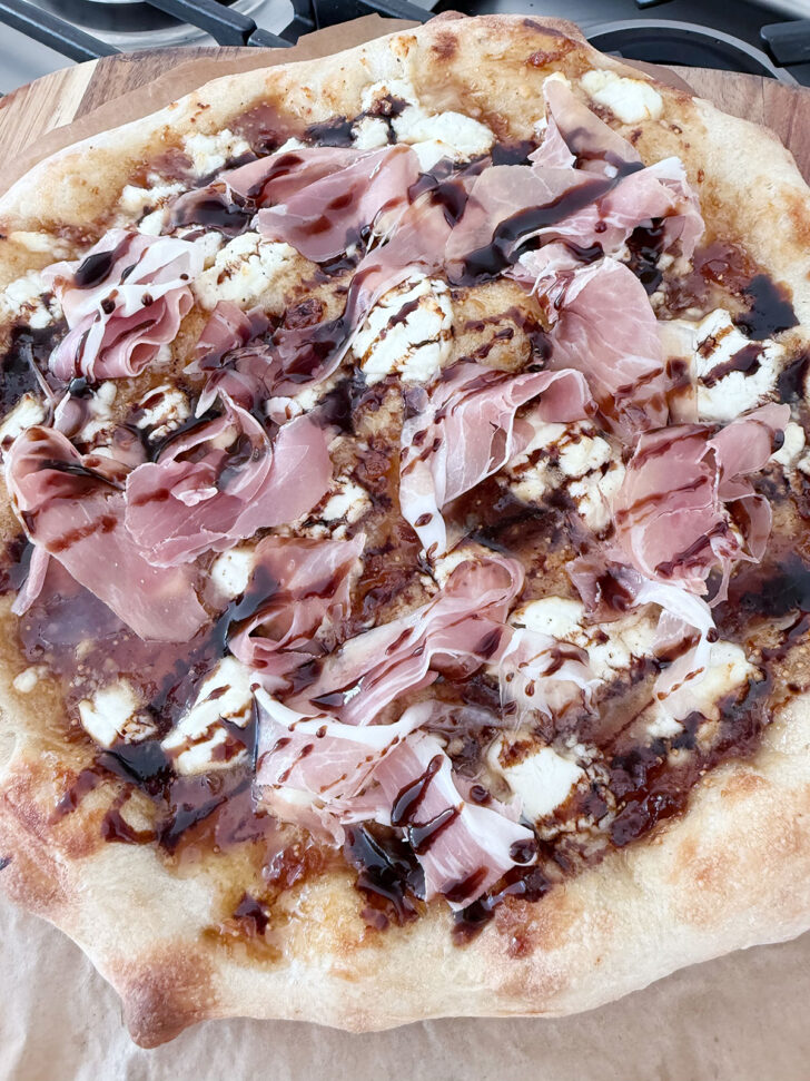 Balsamic glaze drizzled over the pizza.